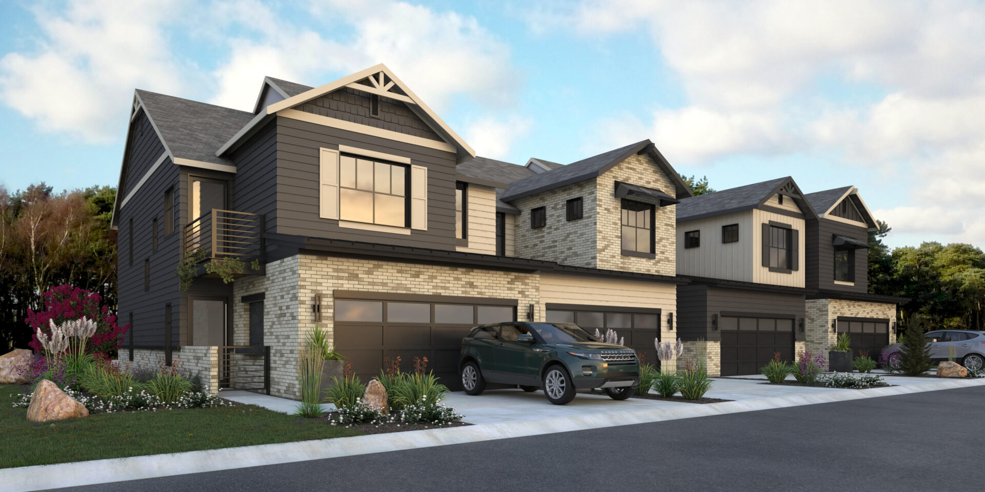 A car parked in front of two story houses.