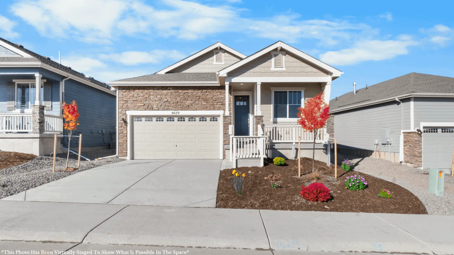 Suburban single-story house with colorful landscaping